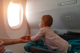Baby sneaks into Emirates Airline Business Class flight